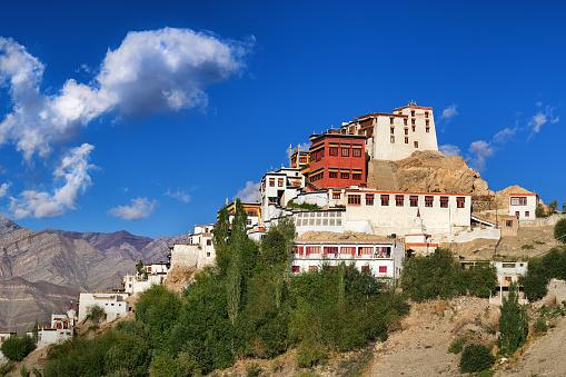 Thiksay monastery with view of Himalayan mountians and blue sky in background,Ladakh,Jammu and Kashmir, India