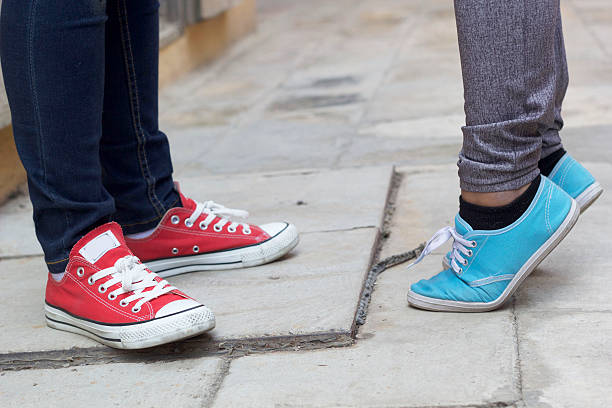 istock men and women legs wearing sneakers. 535868759