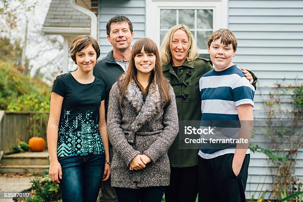 Two Parent Family With Three Teenage Children At Home Stock Photo - Download Image Now