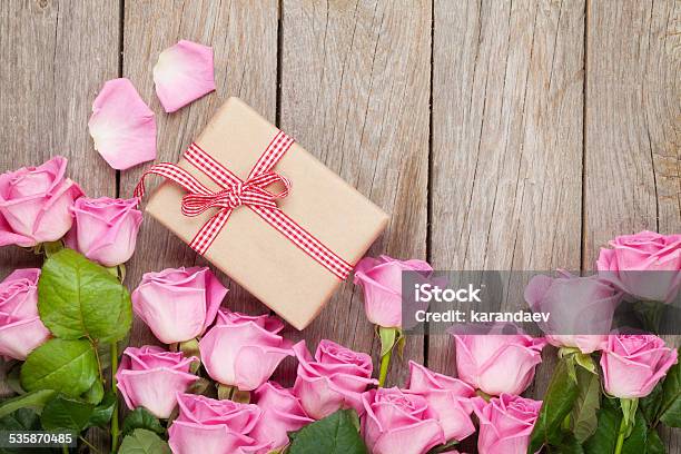 Valentines Day Background With Pink Roses Over Wooden Table Stock Photo - Download Image Now