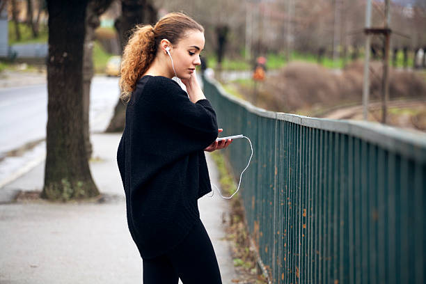 istock young woman with mobile phone 535873687