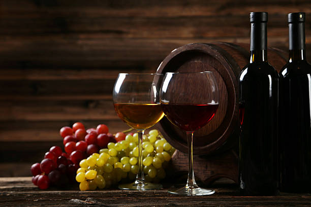 istock Glass of red and white wine with grapes 535874101