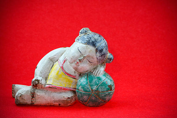 istock China doll on red background, for Chinese new year 535875565