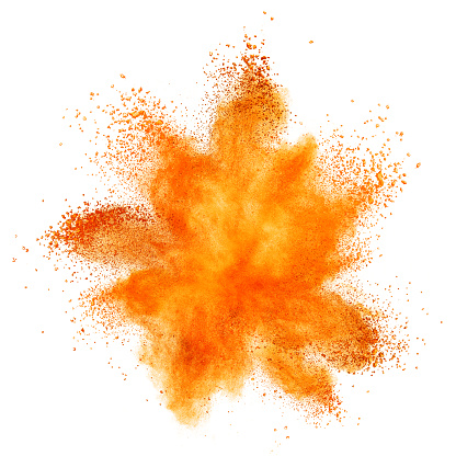 Explosión del polvo de naranja Aislado en blanco photo