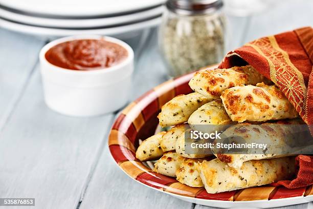 Cheesy Asiago Breadsticks And Marinara Sauce Stock Photo - Download Image Now - Breadstick, Cheese, Marinara