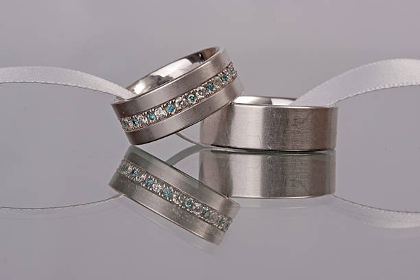 istock Wedding rings on a glass plate with reflection 535887617