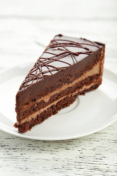 istock Dark chocolate cake on white wooden background 535888713