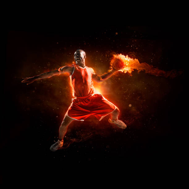 Close-up of real fire flames. Black background, space for copy.