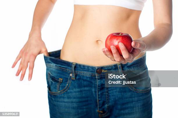 Slim Woman With Apple Stock Photo - Download Image Now - 2015, Adult, Apple - Fruit