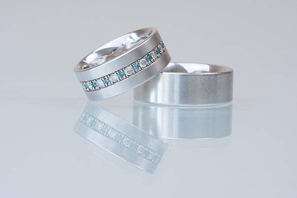 istock Wedding rings on a glass plate with reflection 535891037