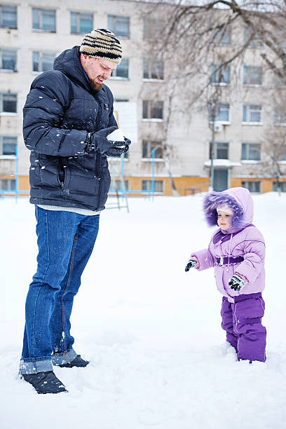 istock Father and daughter in winter park 535892355