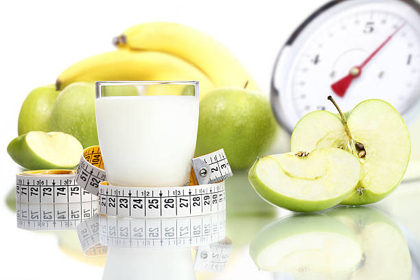 istock diet food milk glass, fruit Apple meter scales 535894529
