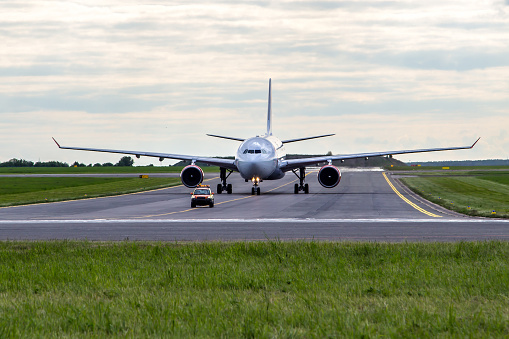 Aircraft taxiing for follow me car at the airport