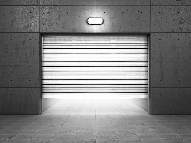 istock Garage building made of concrete with roller shutter doors 535895783