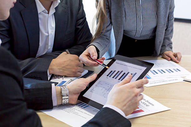 Close up image of business team discussing the data