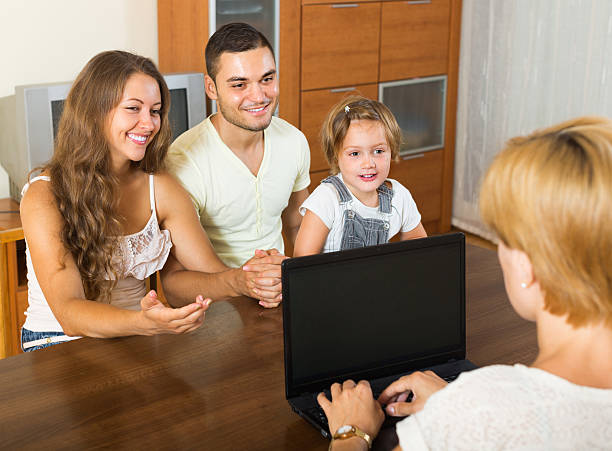istock Banking assistant and satisfied family 535898213