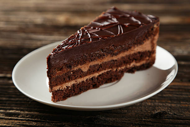 istock Dark chocolate cake on brown wooden background 535898313