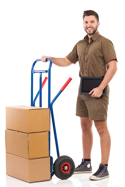 istock Messenger with a digital tablet posing with a push cart 535898813