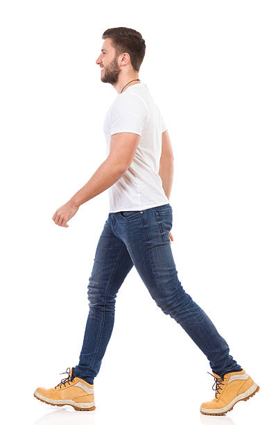 istock Man walking in jeans and white t-shirt 535898827
