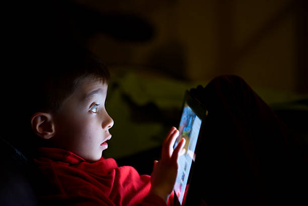 istock child in the dark surprised use tablet father's 535898935