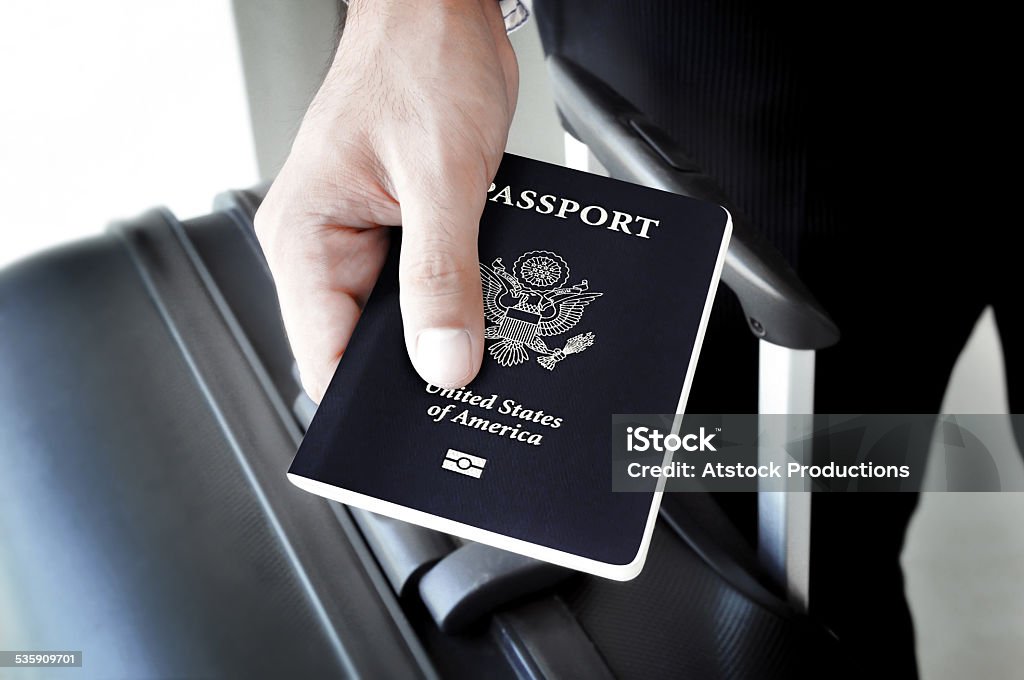 Hand holding U.S. passport Journey Stock Photo