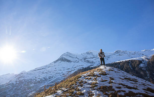 istock Trail runner bounds down snowy mountain slope 535914611