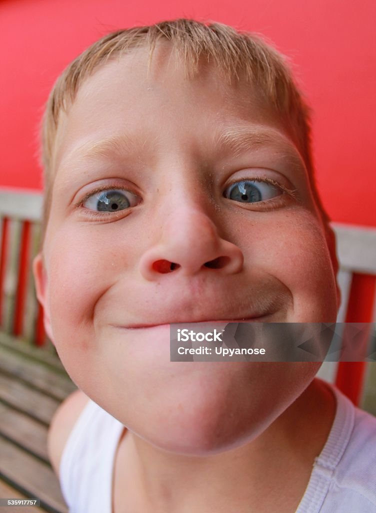 Prominent chin A child pulling a funny face Child Stock Photo