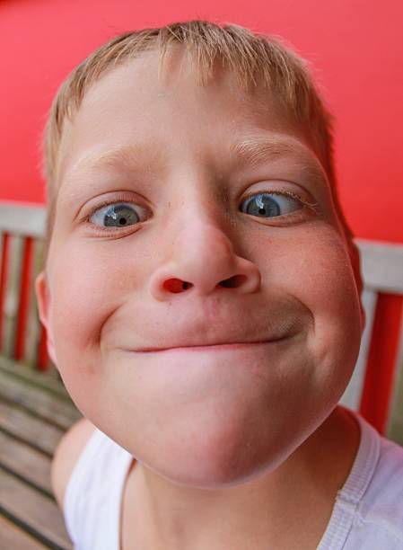 Prominent chin A child pulling a funny face flared nostril photos stock pictures, royalty-free photos & images