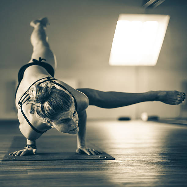 istock Young woman exercising yoga 535918139