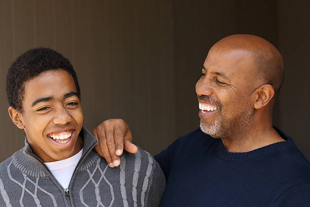 istock African american Father and son Talking 535919193