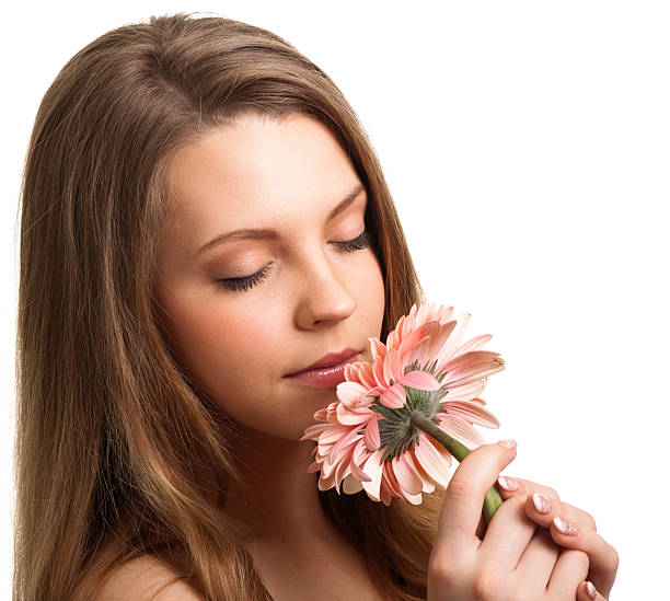 istock Pretty young woman with a pink flower 535920733