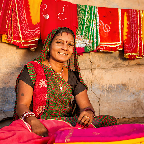 istock Indian woman selling colorful fabrics 535921261