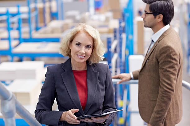 istock Female warehouse manager with a digital tablet 535933647