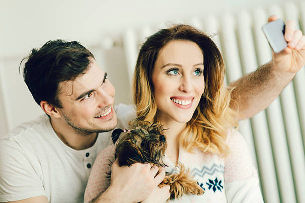 istock Young Couple With Their Dog Making Selfie. 535933989
