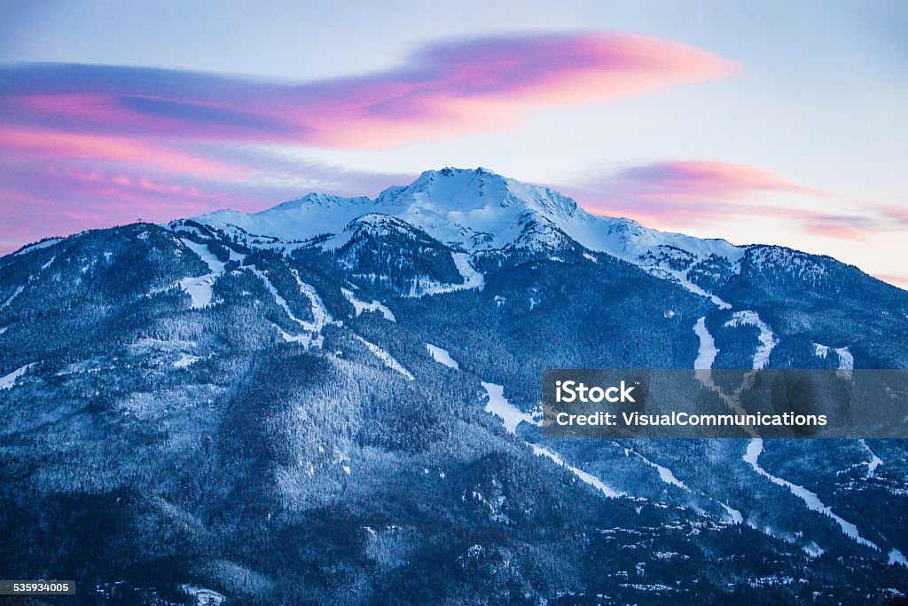 Whistler mountain at dusk. Pink clouds above Whistler peak. Whistler - British Columbia Stock Photo