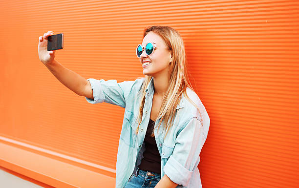 istock Summer, fun, technology and people concept - cool hipster girl 535934685