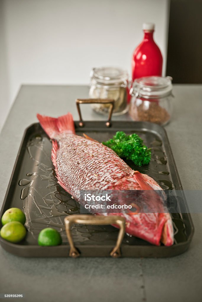 Red snapper Red snapper with lemon and parsley 2015 Stock Photo