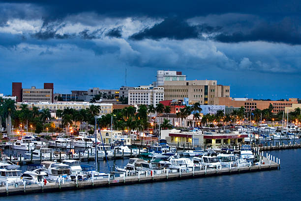 Yacht Basin 2 Overlooking downtown Fort Myers, Florida with the yacht basin in the foreground.  Typical summer late afternoon with storm clouds lingering. fort myers photos stock pictures, royalty-free photos & images
