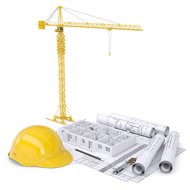 istock Apartment block under construction, crane, blueprints, drawing instruments, hard hat 535936081