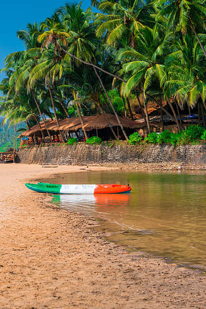 istock sandy beach in the tropics and canoes by the river 535937851