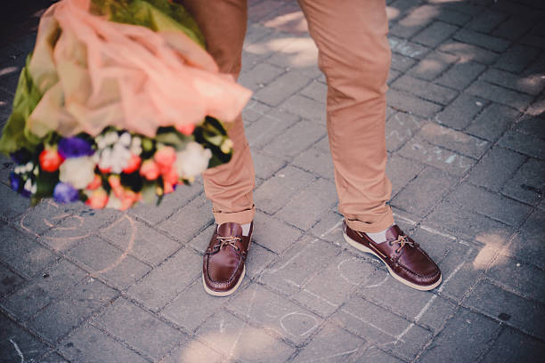 istock Man holding bouquet of flowers 535942683