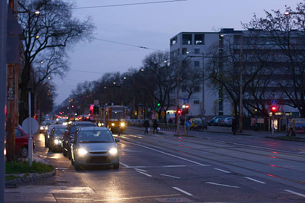 istock city street with traffic at sunset 535963483
