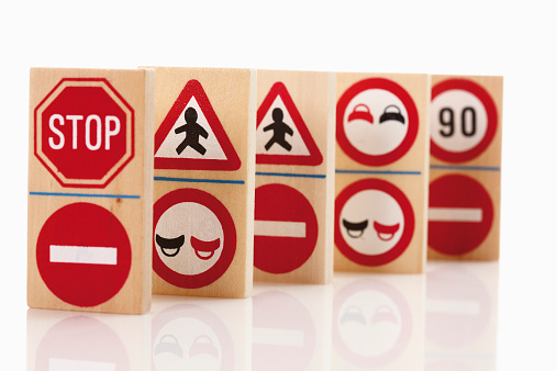 Domino with traffic signs on white background