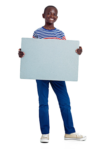 Full length studio shot of an african teenage boy holding a blank boardhttp://195.154.178.81/DATA/istock_collage/0/shoots/784979.jpg