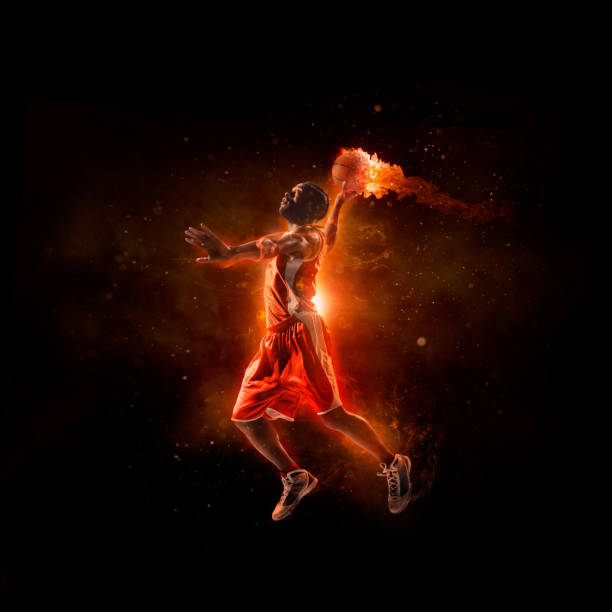 istock Basketball player in jump shot with fireball 535967709