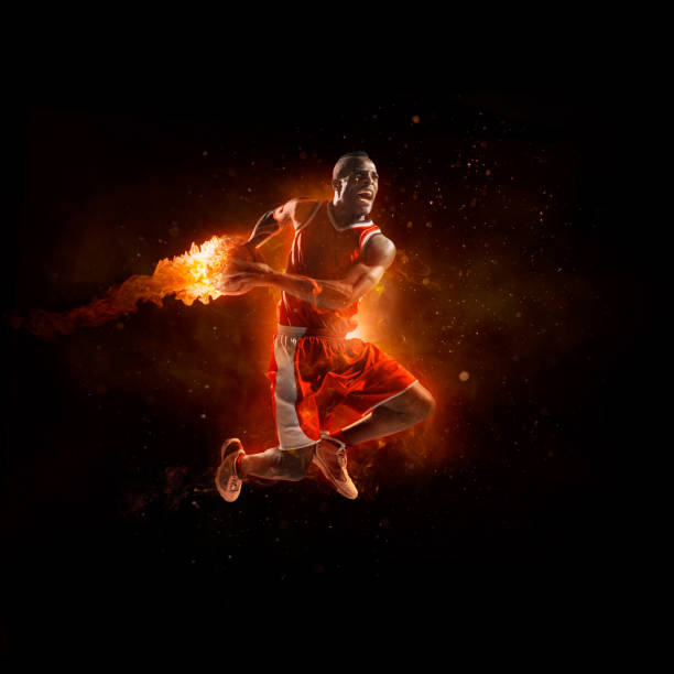 istock Basketball player in jump shot with fireball 535967853