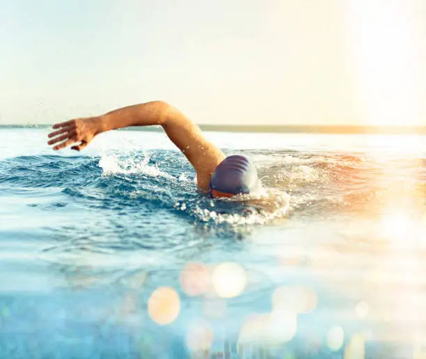 Man Swimming outdoors