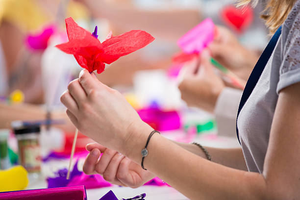 istock Women making paper flowers 535968041