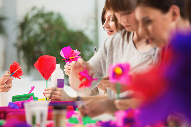 istock Group of women making paper flowers 535968461