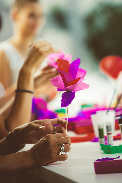 istock Women making paper flowers 535968463
